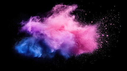 Colorful powder explosion against black background
