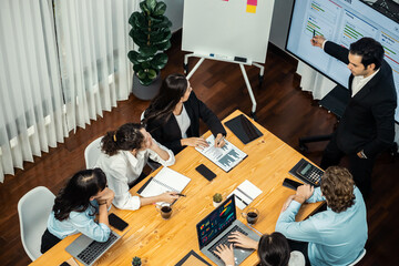 Project manager planning schedules for business task at meeting room, Gantt chart software show on...