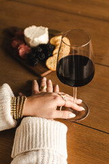 Woman with charcuterie and wine