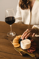 Woman with wine and charcuterie