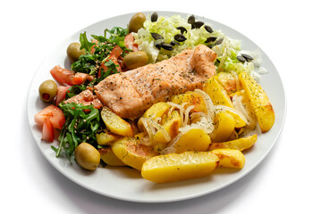 Baked salmon with vegetables and potatoes. Healthy food.