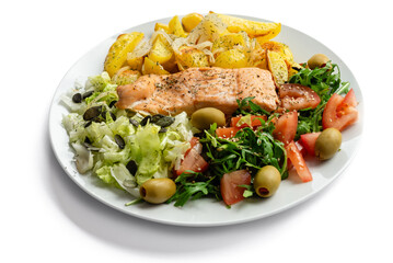 Baked red fish with vegetables and potatoes. Healthy food.