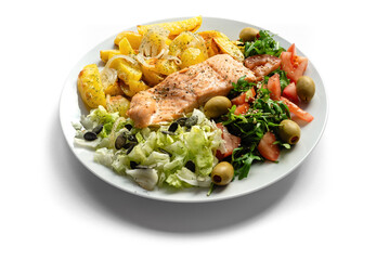 Baked salmon fish with vegetables and potatoes. Healthy food.
