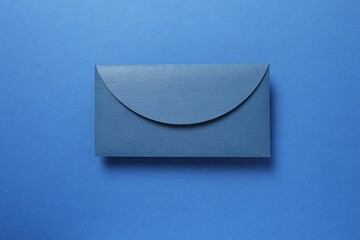 Paper envelope on a colored background