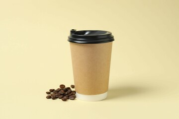 Paper cup with plastic lid on light background. Coffee to go