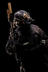 Special forces soldier equipped with tactical gear and night vision device