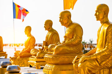 Golden buddha statues on Phuket, serene glimpse into thai spiritual heritage