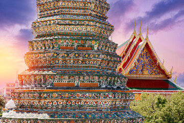 Wat Arun stunning architecture and colorful tiles in Bangkok, Thailand at sunset