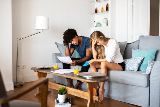 Couple facing financial difficulties together at home