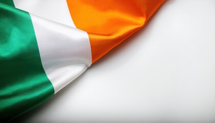 Irish flag gently draped on a surface showcasing green, white, and orange colors