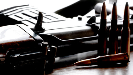 Kalashnikov assault rifle on a wooden background