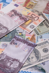 A background consisting of paper banknotes of different currencies