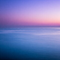 Obraz premium Deep ocean in different shades of blue soft reflections of the lilac sunset