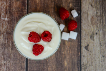 Greek yogurt with raspberries and coffee, healthy breakfast