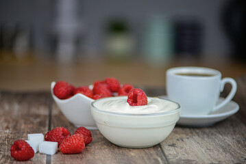 Greek yogurt with raspberries and coffee, healthy breakfast