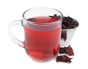 Delicious hibiscus tea in glass cup and dry roselle sepals isolated on white