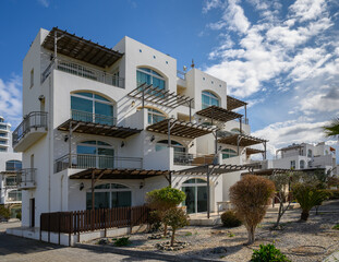 Elegant seaside villa showcasing contemporary architecture and serene surroundings in a coastal...
