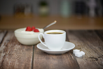 Fresh aromatic coffee on a wooden kitchen table