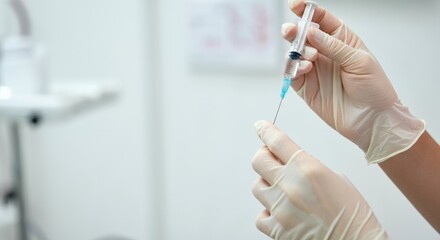 Close-up of hands with gloves preparing syringe for medical injection