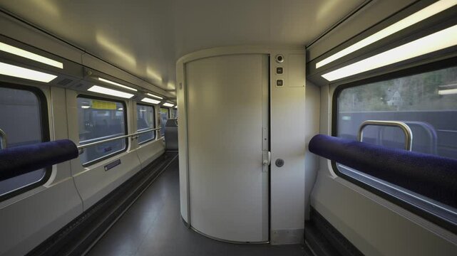 Modern and spacious train restroom in Swiss intercity train. Designed for wheelchair accessibility, featuring automatic door, handrails and clean interior. Ideal for comfortable, barrier-free travel. 