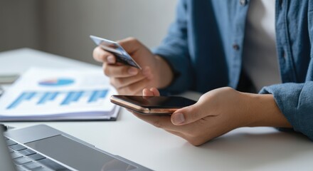 Person using smartphone and holding credit card Online shopping concept