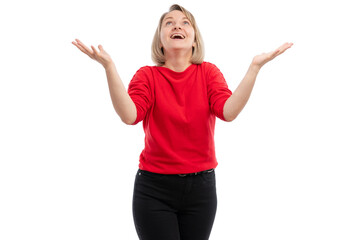 A young woman in a red sweater joyfully raising her arms against a white background.