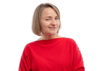 A cheerful woman winking and smiling while wearing a red sweater against a white background.