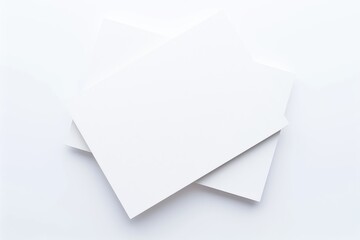 Three blank white business cards stacked on a clean background, ideal for branding, mockups, and corporate identity design. Great for marketing and presentation materials