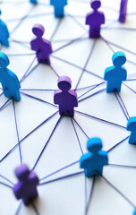 Wooden figures connected by blue strings representing social network 
