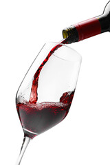 Pouring red wine into glass isolated on white