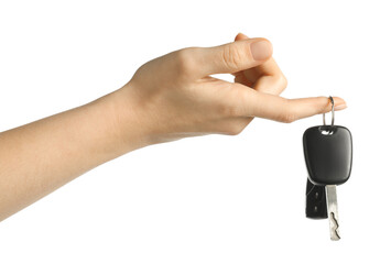 Woman with car keys on white background, closeup