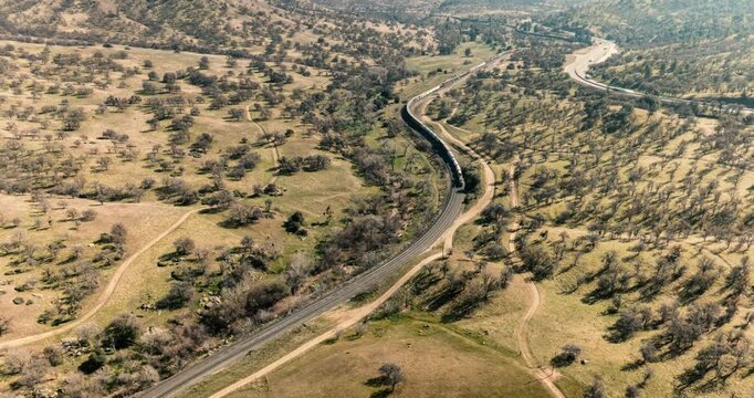 Drone Hyperlapse of Train Running Through Mountains Towards Tehachapi Loop