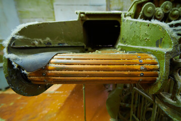 Intricate details of machinery in a felt production plant showcasing the art of crafting soft...