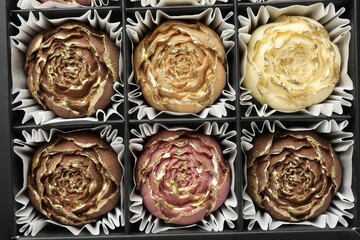 Flower shaped chocolate bonbons in box, top view
