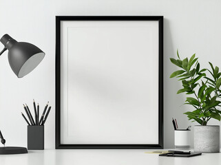 A minimalist workspace featuring a blank frame mockup, stationery and a potted plant on white desk.