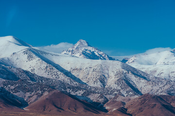 Winter snowy mountain peaks in Kyrgyzstan
