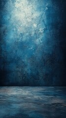 Textured blue wall and floor create a serene atmosphere in an empty space for artistic expression