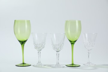 Many empty clean glasses on light background