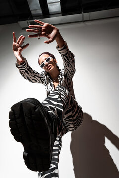 Fashion Model Posing in Animal Print with Flash Lighting