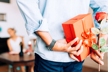 Romantic surprise with red gift box and rose