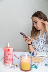 Modern Mystic Woman Practicing Divination with Candles and Tarot
