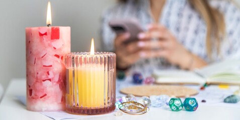 Modern Mystic Woman Practicing Divination with Candles and Tarot