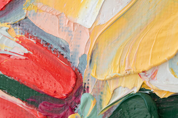 Fragments of vibrant color created with a palette knife in an abstract oil painting composition
