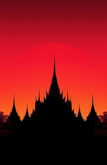 Silhouette of a traditional temple against vibrant sunset sky