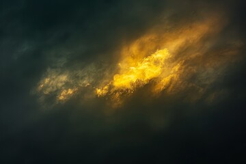 Naklejka premium Golden light breaks through dark clouds during a sunset, illuminating the sky with patches of yellow, Sunlit patches of yellow breaking through a cloudy atmosphere