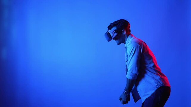 Smart golf player playing golf in metaverse while wearing VR glasses. Attractive sport man exercising and making playing golf posture by using virtual reality technology innovation. Sport. Apparatus.