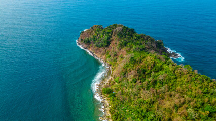 Aerial View of Lush Green Island Surrounded by Crystal Clear Waters in Sapzurro, Choco, Colombia