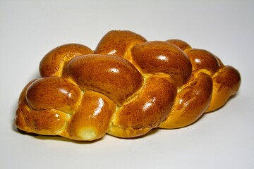 Close-up photo of a sweet breakfast pastry, braided brioche
