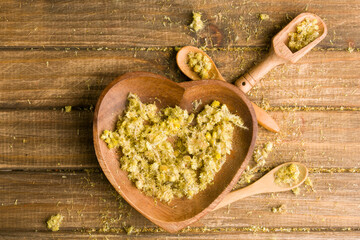 dry flowers of silverweed on wooden background