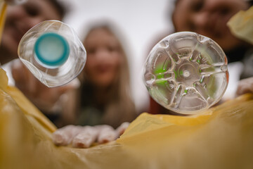 view from inside of the bag young volunteer collect plastic waste